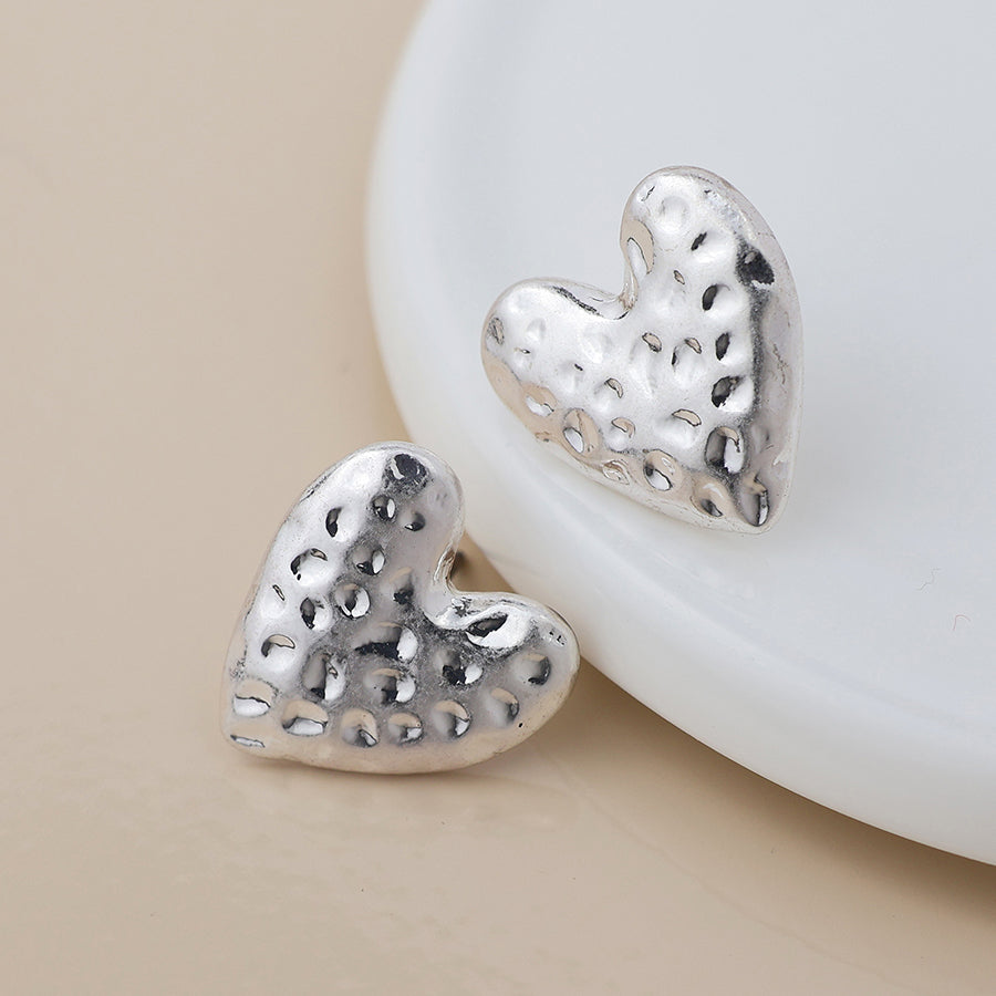 POM Silver plated worn hammered heart earrings
