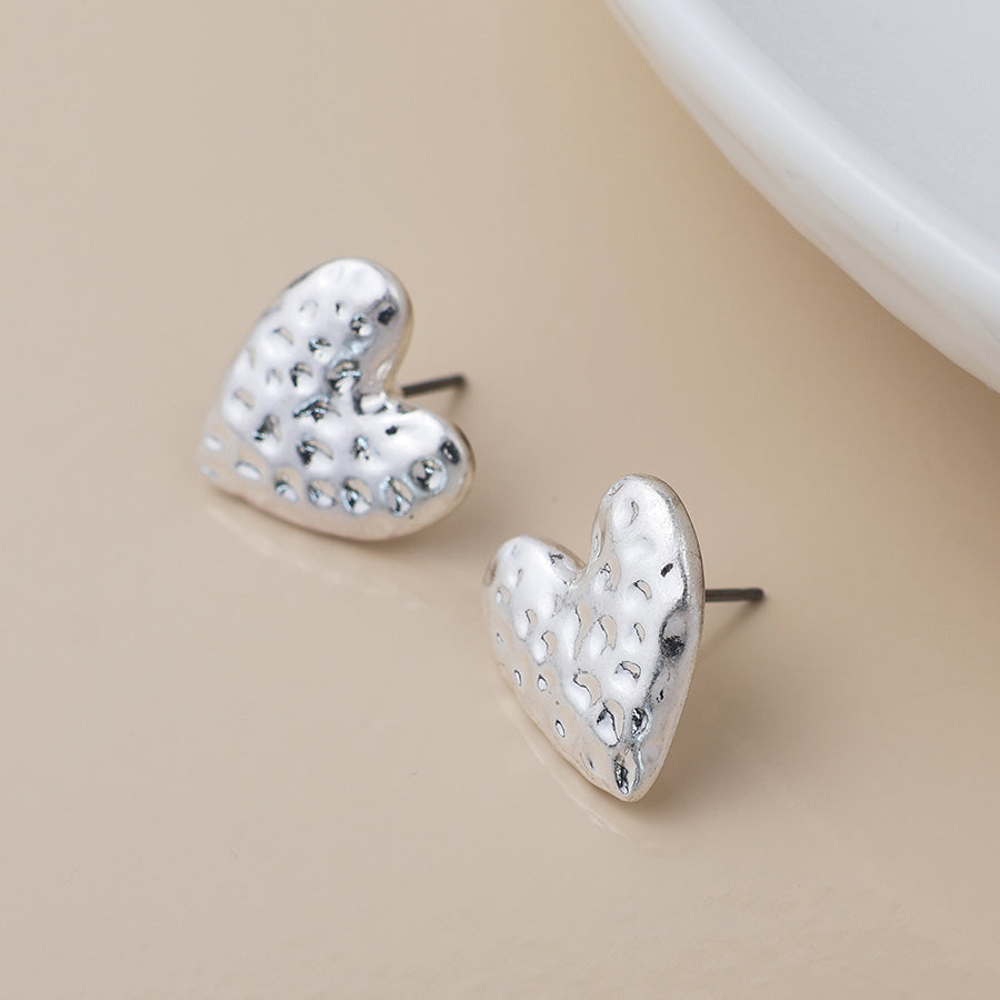POM Silver plated worn hammered heart earrings